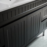 Bathroom vanity with black cabinets and a white countertop.
