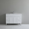 White bathroom vanity with sink against a gray wall