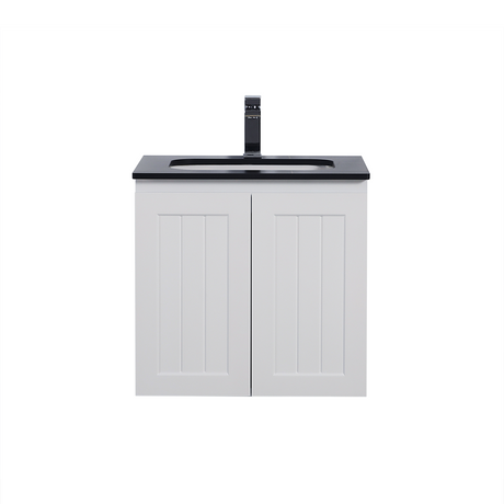 White bathroom vanity with black countertop and faucet on a white background