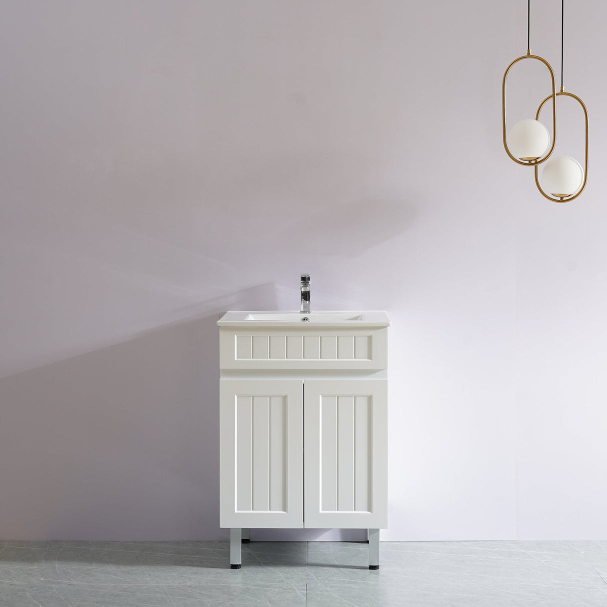 White bathroom vanity with sink against a white wall with modern pendant lights.