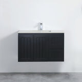 Black bathroom vanity with white countertop against a white wall