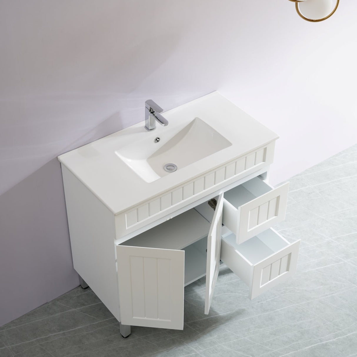 Bathroom vanity with sink and open cabinet door on a light gray floor.