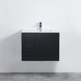 Black bathroom vanity with white countertop against a white wall.