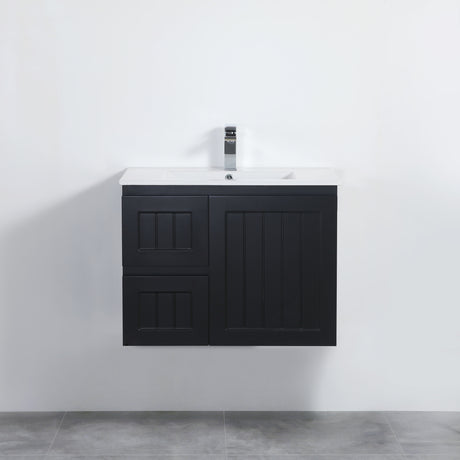 Black bathroom vanity with white countertop against a white wall.