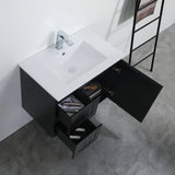 Bathroom vanity with open drawer, sink, and ladder against a white wall.