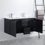 Black bathroom vanity with open cabinet doors in a modern bathroom setting.