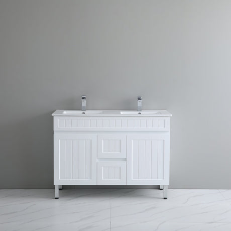 White bathroom vanity with two sinks against a gray wall.