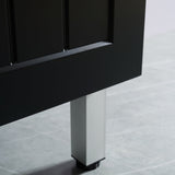 Close-up of a black cabinet leg on a tiled floor