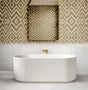 Modern freestanding bathtub in a bathroom with patterned wallpaper and mirror.