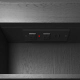 Wooden cabinet with electrical outlets and a red light indicator.