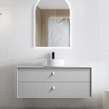 Bathroom vanity with mirror and sink on a light gray wall.