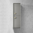 Tall metallic cabinet with two doors on a concrete wall