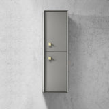 Tall metallic cabinet with two doors on a concrete wall