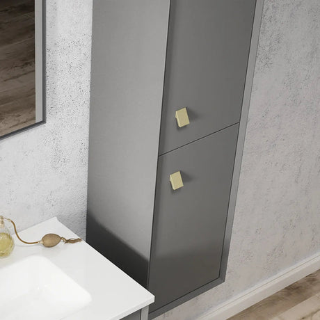 Gray cabinet with gold handles in a bathroom setting