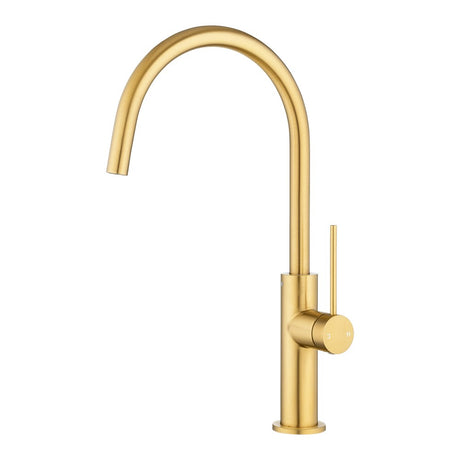 Brushed brass kitchen faucet on a white background