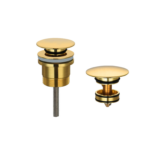 Gold-plated pop up waste components on a white background