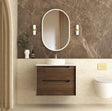 Bathroom vanity with wooden cabinet, round mirror, and decorative elements.