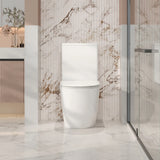White toilet in a modern bathroom with marble walls and floor.