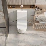 Modern white toilet in a bathroom with marble walls and floor