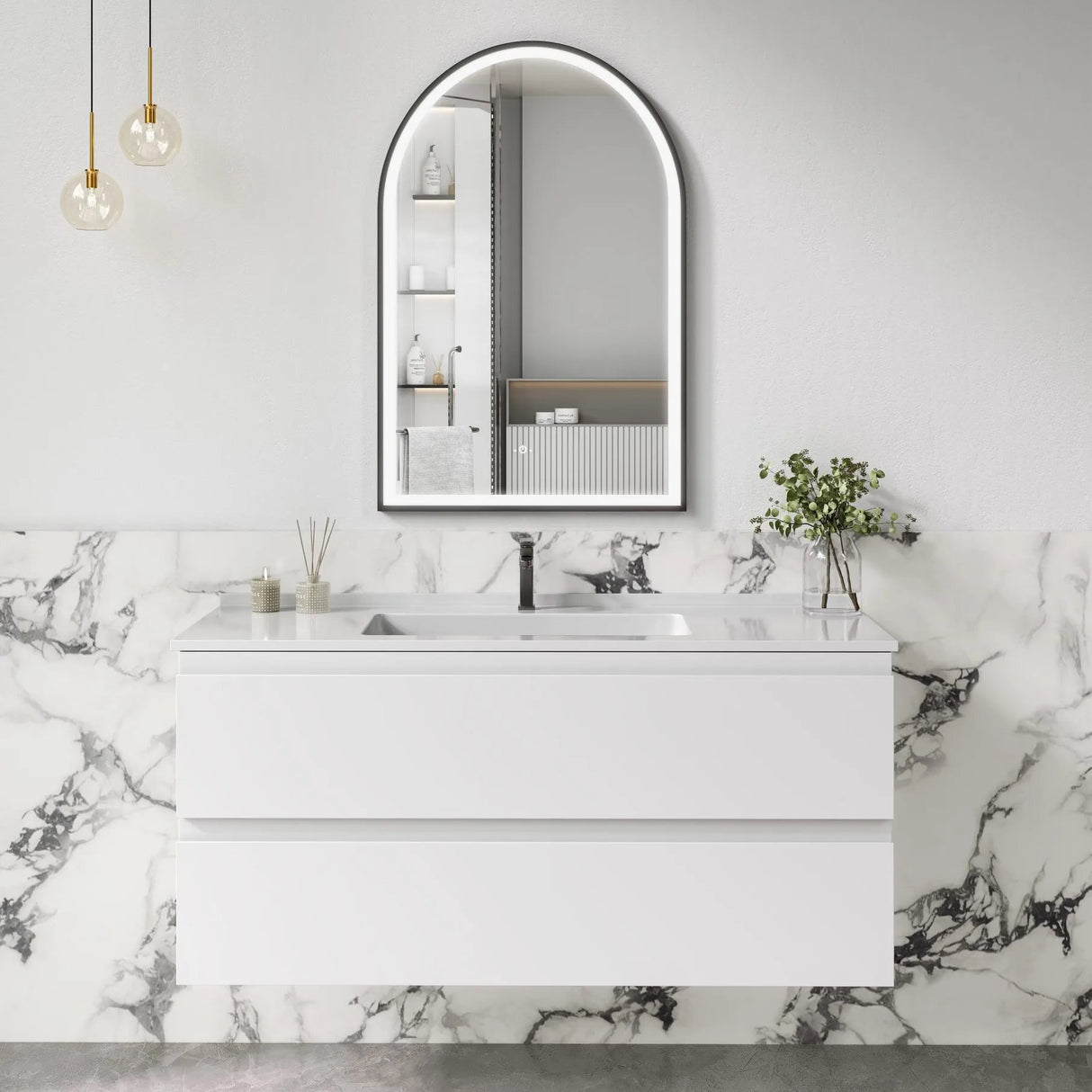Bathroom vanity with marble wall and arch mirror