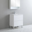 Bathroom vanity with sink and mirror cabinet against a gray wall.
