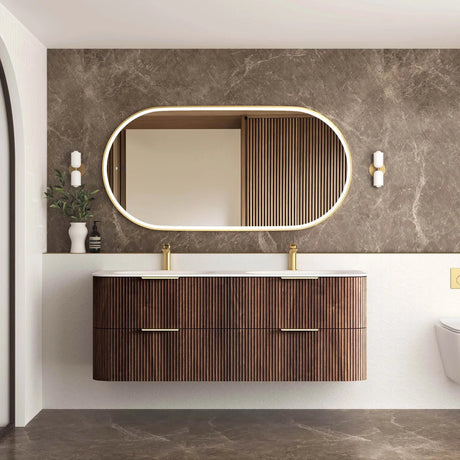 Bathroom vanity with wooden cabinet, mirror, and decorative elements.