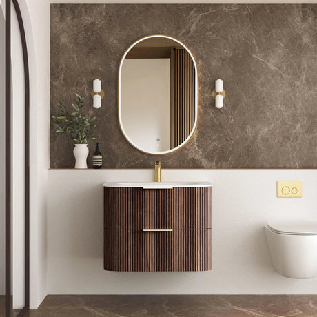 Modern bathroom with wooden vanity, round mirror, and decorative elements.