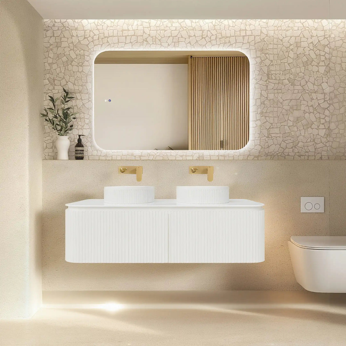 Modern bathroom with a white vanity, mirror, and decorative elements.
