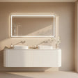 Bathroom vanity with a large mirror in a neutral-toned room