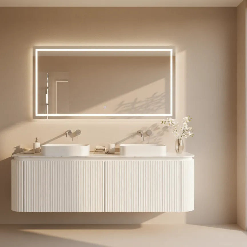 Bathroom vanity with a large mirror in a neutral-toned room