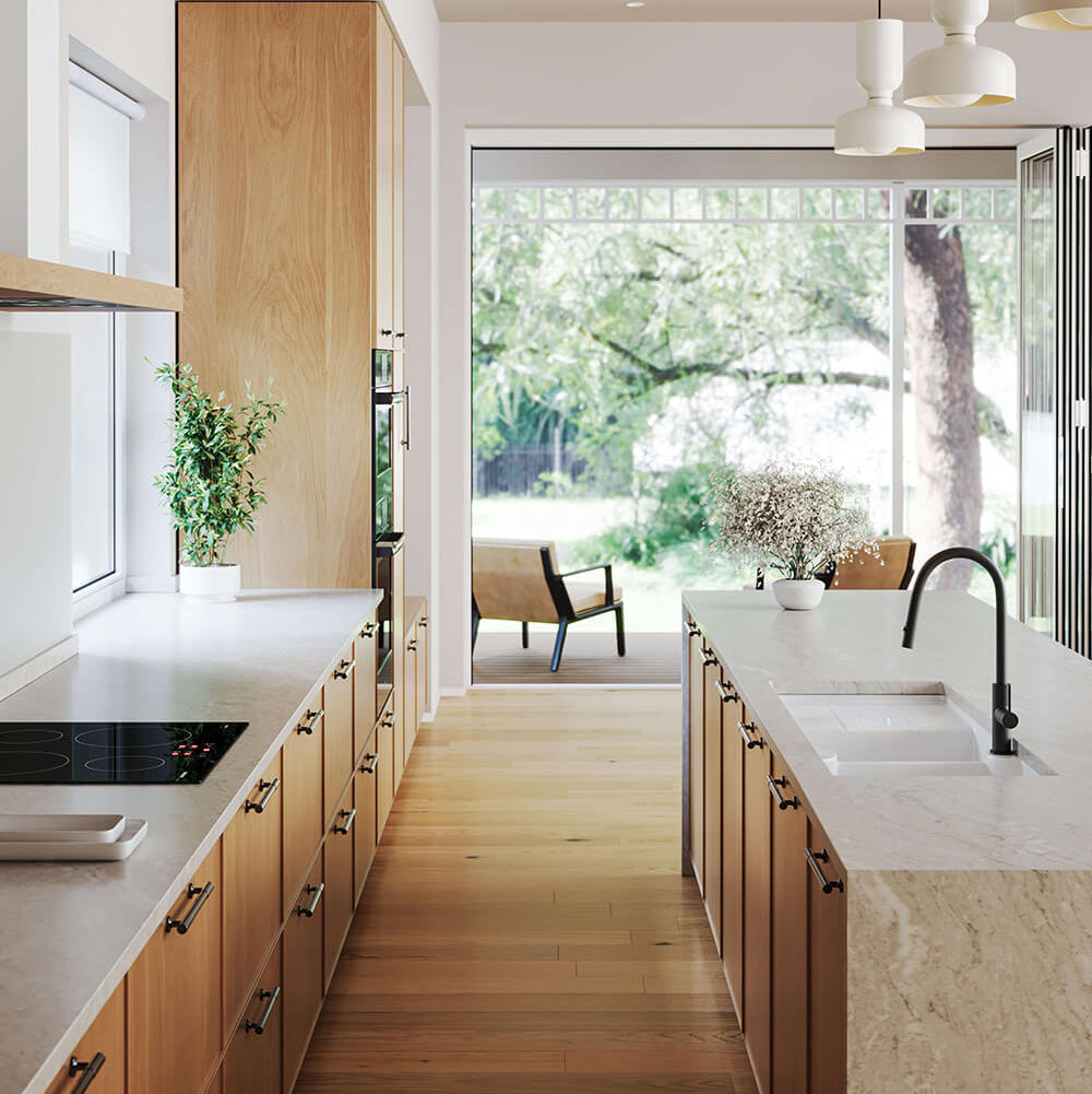 Modern kitchen with wooden cabinets, white countertops, and a view of greenery outside.