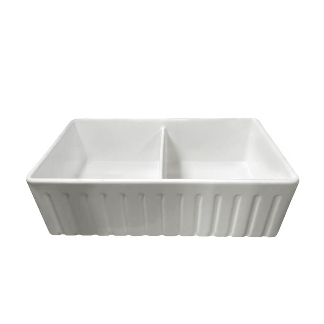 A white ceramic double-bowl sink with a ribbed exterior, shown from a front-three-quarters angle on a solid white background.