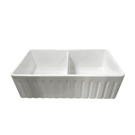 A white ceramic double-bowl sink with a ribbed exterior, shown from a front-three-quarters angle on a solid white background.