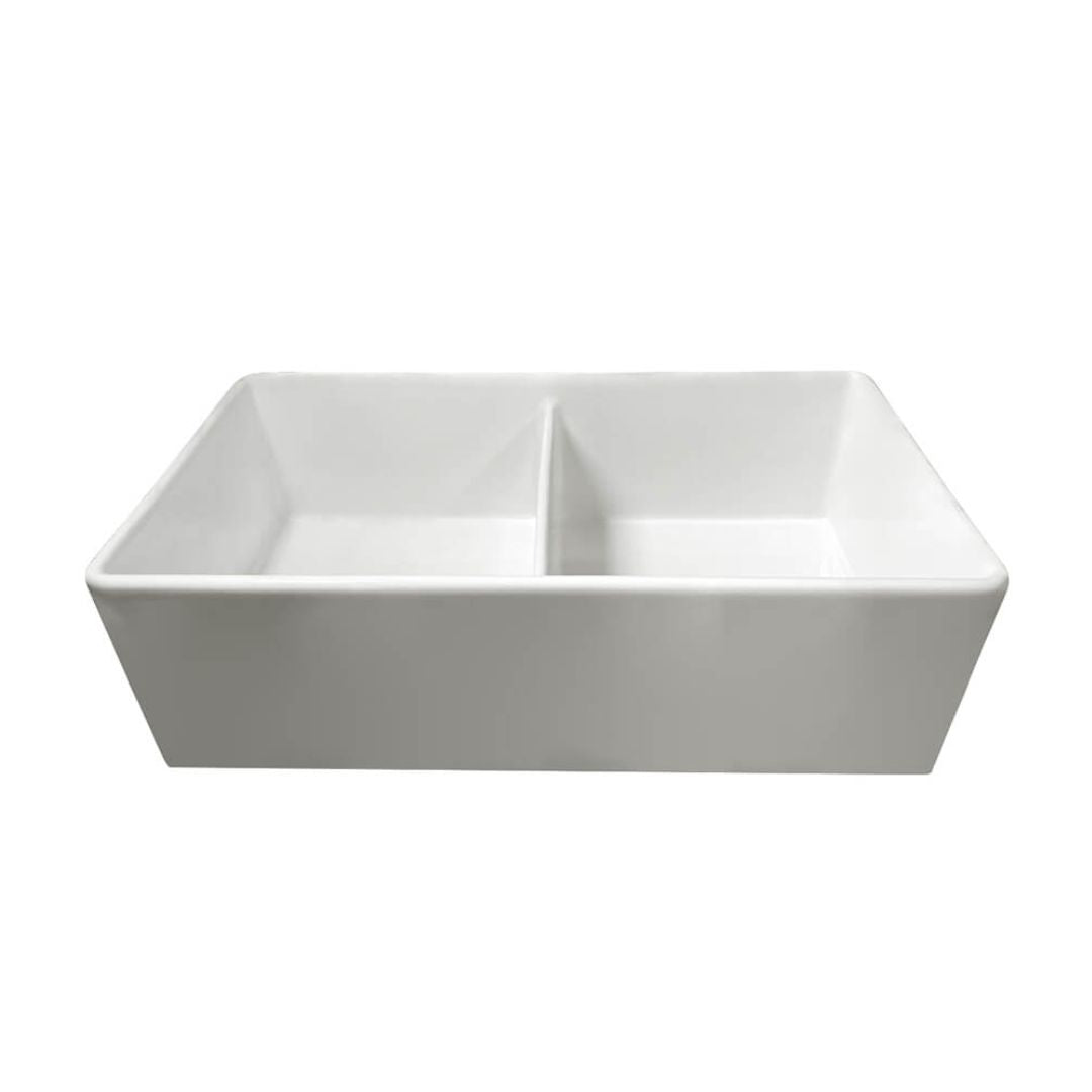 A white ceramic double-bowl farmhouse sink with a rectangular shape and a central divider, shown against a plain white background.