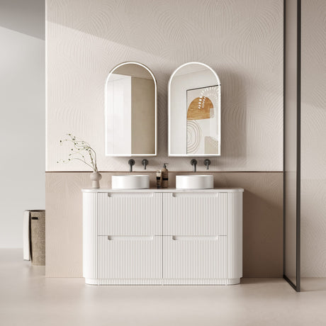 Bathroom vanity with two sinks and mirrors in a modern setting