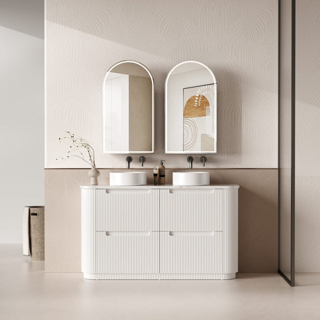 Bathroom vanity with two sinks and mirrors in a modern setting