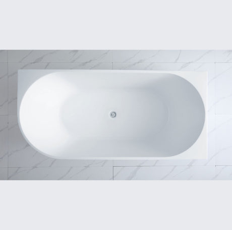 White oval bathtub against a light gray tiled wall