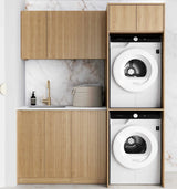 Modern laundry room with wooden cabinets and white washing machine and dryer.