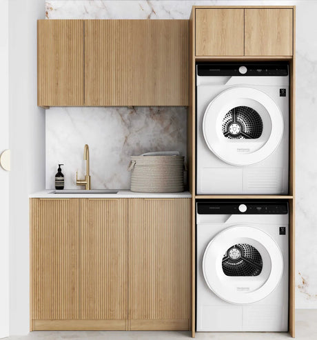 Modern laundry room with wooden cabinets and white washing machine and dryer.