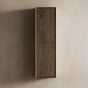 Wooden cabinet with a dark finish on a beige wall