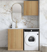 Modern laundry room with wooden cabinets, white dryer, and marble wall.