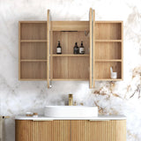 Bathroom vanity with wooden cabinets and marble wall