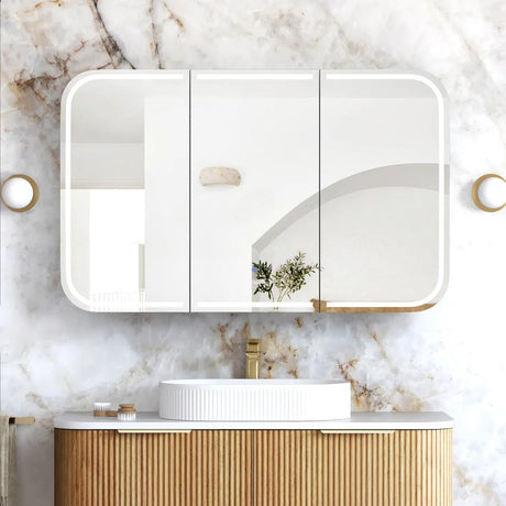 Bathroom vanity with a mirror and marble wall