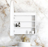 White bathroom cabinet with shelves against a marble wall.
