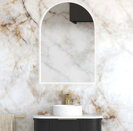 Bathroom with marble wall, sink, and towel