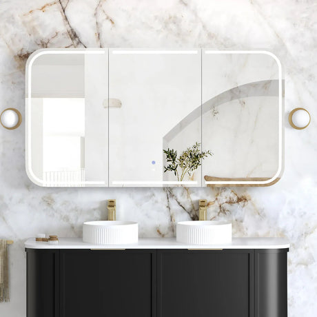 Bathroom vanity with black cabinets, white marble countertop, and large mirror with light fixture.