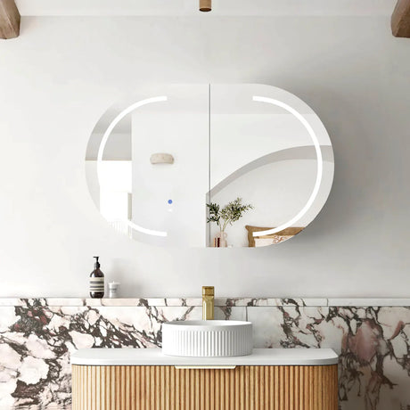Bathroom vanity with a round mirror and marble countertop