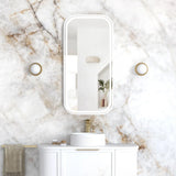 Bathroom vanity with mirror and sink against a marble wall