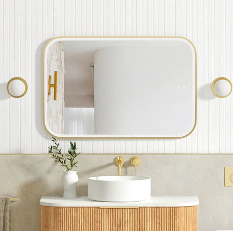 Bathroom vanity with a mirror, sink, and decorative elements.