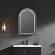 Bathroom vanity with arch-shaped mirror and pendant light